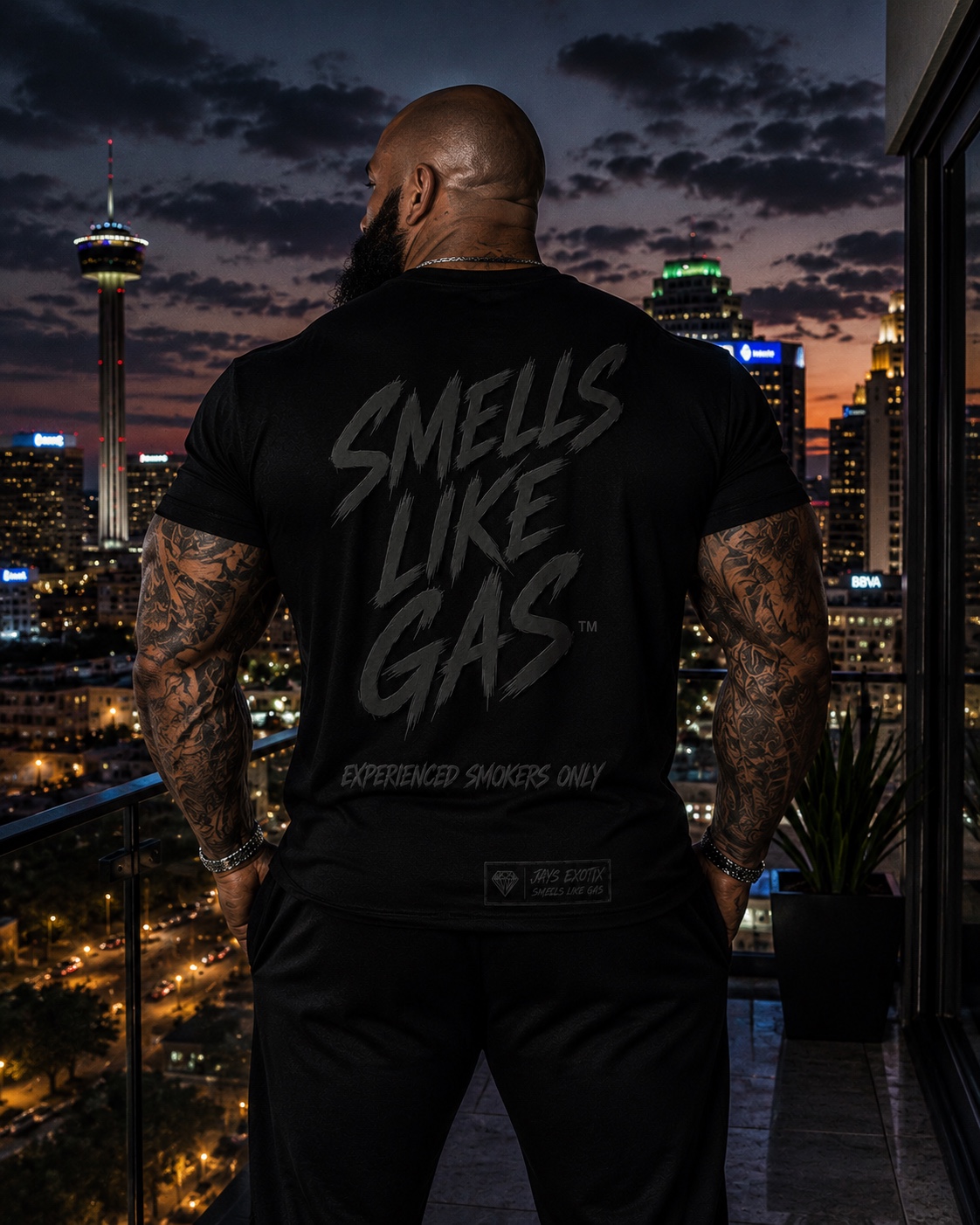 Real Trapper tee worn with the San Antonio skyline visible on the back